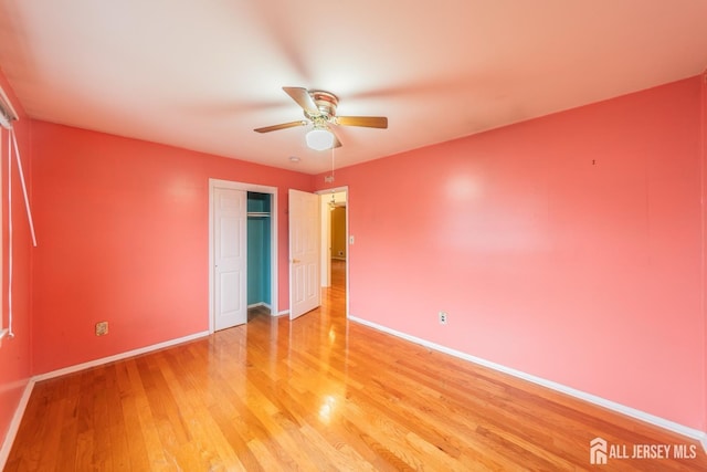 289 Old Rd, Sewaren, NJ 07077 - unfurnished bedroom with light wood-style floors, baseboards, a closet, and ceiling fan
