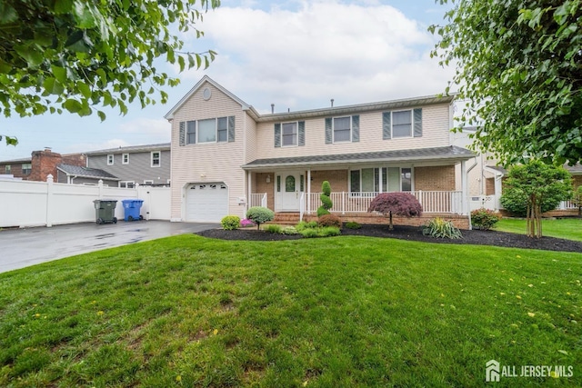 289 Old Rd, Sewaren, NJ 07077 - view of front of house with driveway, an attached garage, covered porch, and brick siding
