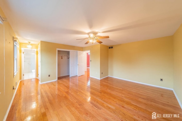 289 Old Rd, Sewaren, NJ 07077 - unfurnished bedroom with light wood-type flooring, baseboards, a closet, and a ceiling fan