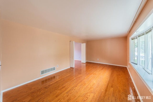 289 Old Rd, Sewaren, NJ 07077 - empty room featuring light wood finished floors and baseboards