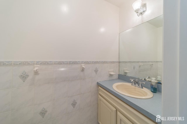 289 Old Rd, Sewaren, NJ 07077 - bathroom featuring vanity, tile walls, and wainscoting