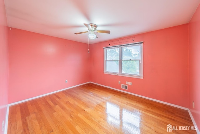 289 Old Rd, Sewaren, NJ 07077 - spare room with light wood-style flooring, a ceiling fan, and baseboards