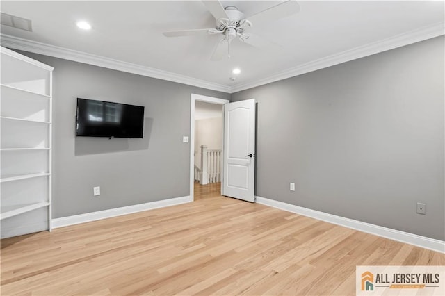 unfurnished bedroom with crown molding, wood finished floors, recessed lighting, baseboards, and ceiling fan