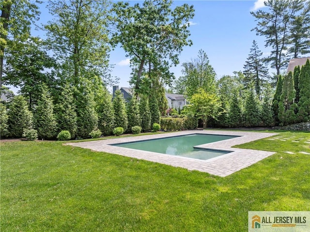 outdoor pool with a yard