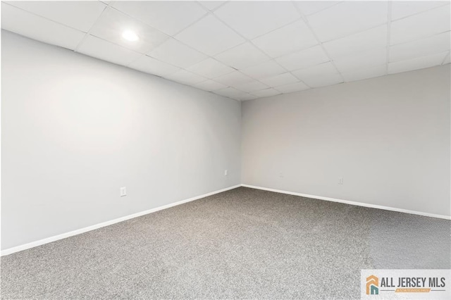 spare room featuring carpet flooring, baseboards, a drop ceiling, and recessed lighting