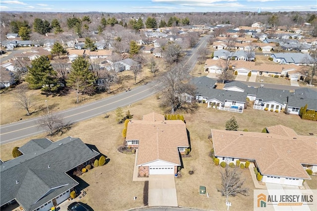 birds eye view of property with a residential view