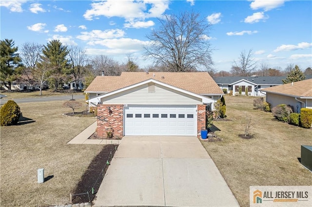 view of front facade with a garage, brick siding, concrete driveway, and a front lawn