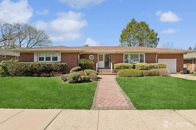 ranch-style home featuring driveway, a front lawn, brick siding, and a garage