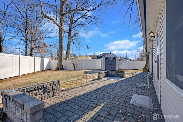 view of patio featuring a storage unit