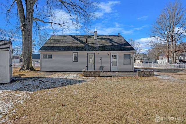 rear view of house with a lawn