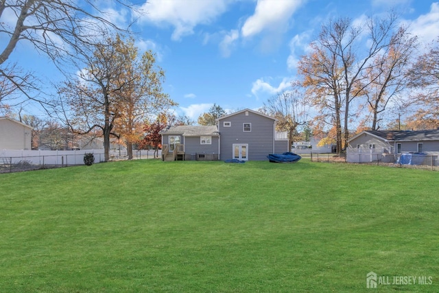 back of house with a yard