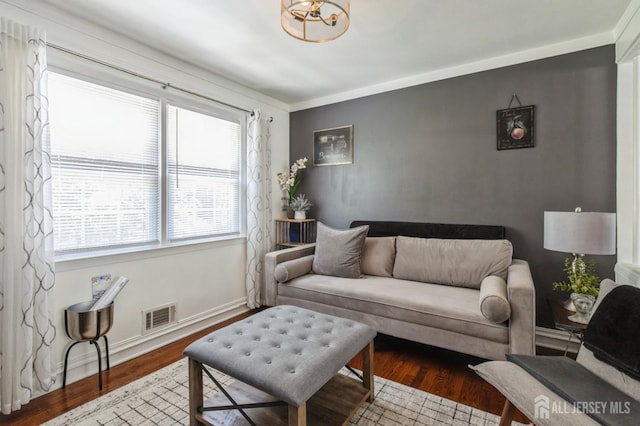 1 Hollywood Dr, Woodbridge Proper, NJ 07095 - living room featuring wood finished floors, baseboards, and a chandelier