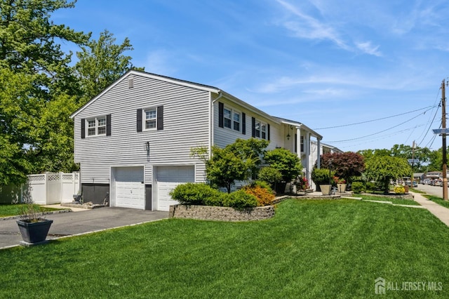 1 Hollywood Dr, Woodbridge Proper, NJ 07095 - view of side of property with asphalt driveway and an attached garage