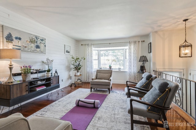 1 Hollywood Dr, Woodbridge Proper, NJ 07095 - living room featuring wood finished floors, a chandelier, and baseboards