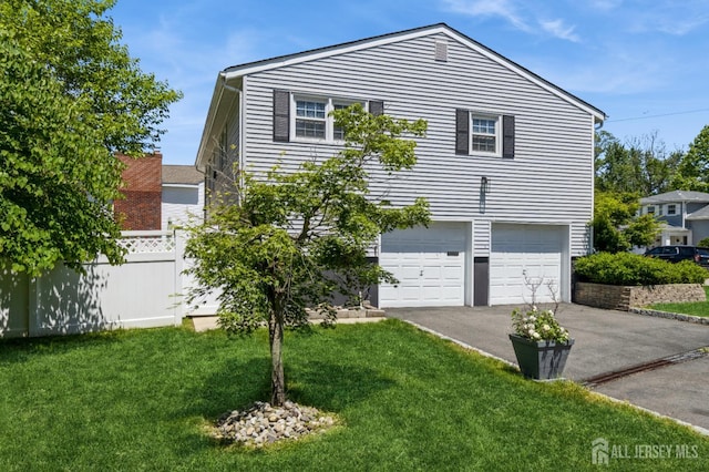 1 Hollywood Dr, Woodbridge Proper, NJ 07095 - view of side of property featuring asphalt driveway and an attached garage