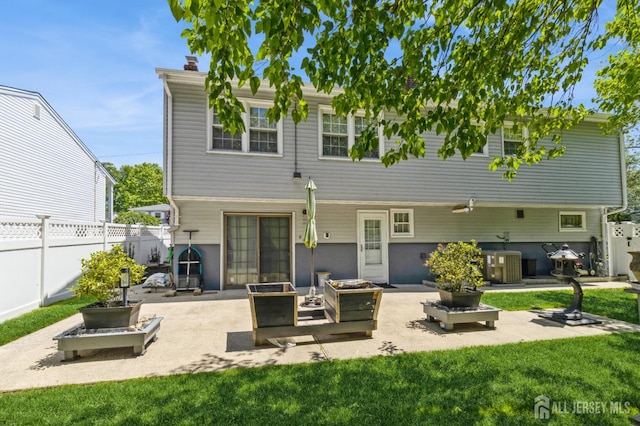 1 Hollywood Dr, Woodbridge Proper, NJ 07095 - back of house featuring a patio area, central air condition unit, and a chimney