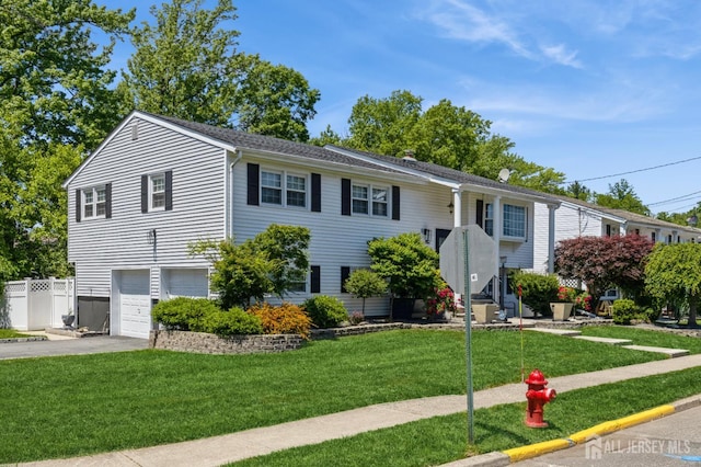 1 Hollywood Dr, Woodbridge Proper, NJ 07095 - raised ranch featuring an attached garage and concrete driveway
