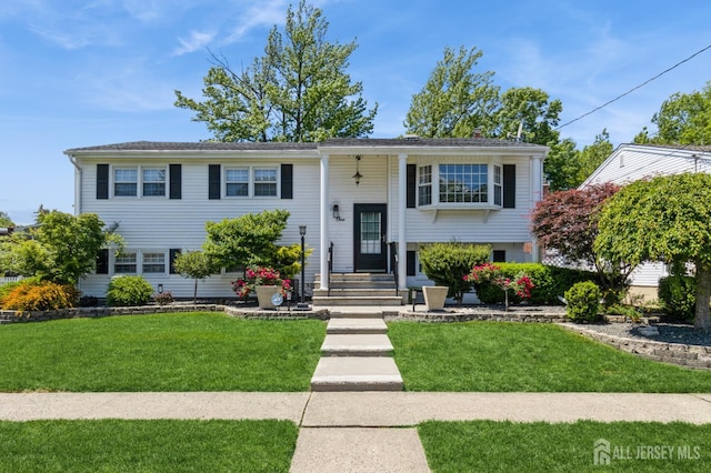 1 Hollywood Dr, Woodbridge Proper, NJ 07095 - bi-level home with a front lawn