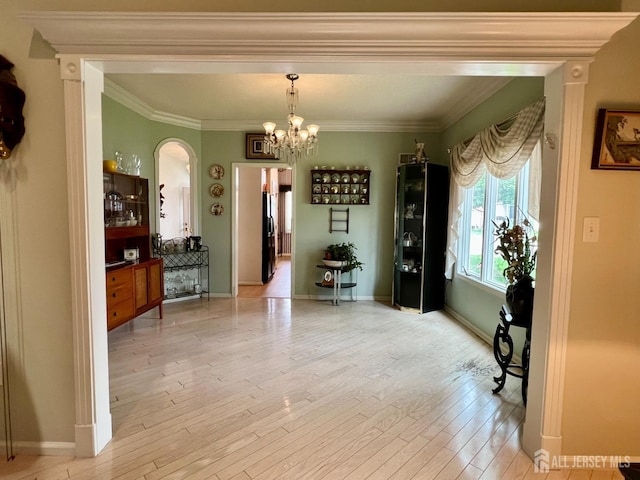 1 Walter Way, Monroe, NJ 08831 - dining space with arched walkways, a chandelier, wood finished floors, and crown molding