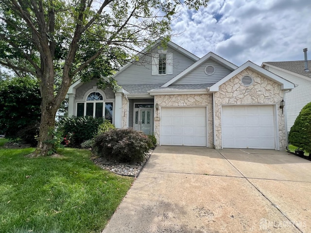 1 Walter Way, Monroe, NJ 08831 - traditional home with concrete driveway, stone siding, an attached garage, a front lawn, and a shingled roof