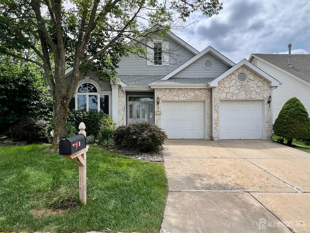 1 Walter Way, Monroe, NJ 08831 - view of front of home featuring stone siding, driveway, an attached garage, and a front lawn