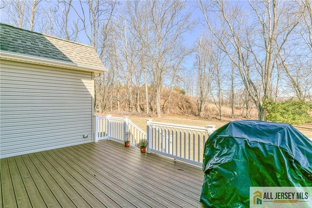 wooden terrace featuring area for grilling