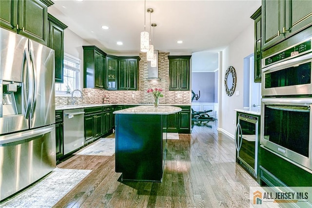 kitchen featuring green cabinets, wine cooler, and stainless steel appliances