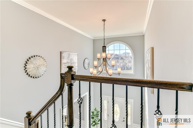 interior space featuring a notable chandelier and ornamental molding