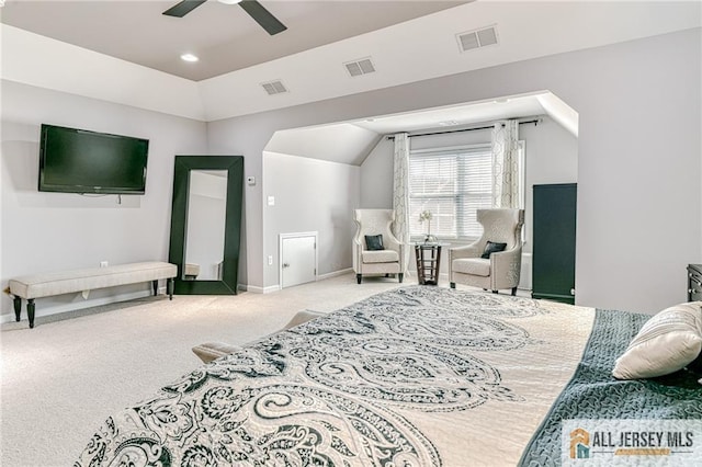 carpeted bedroom featuring visible vents and vaulted ceiling