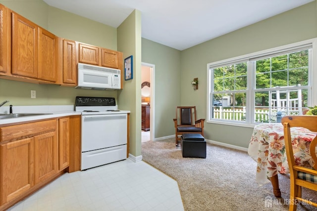 1 Mayfair Ln, Byram, NJ 07821 - kitchen with light colored carpet, a sink, white appliances, light countertops, and baseboards
