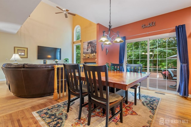 1 Mayfair Ln, Byram, NJ 07821 - dining area featuring high vaulted ceiling, plenty of natural light, wood finished floors, and visible vents