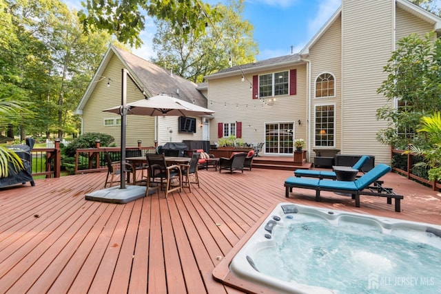 1 Mayfair Ln, Byram, NJ 07821 - rear view of house featuring outdoor dining area, hot tub deck surround, a wooden deck, and an outdoor hangout area