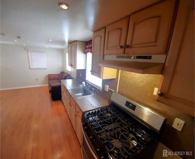 429 Wilfred Ave, Hamilton, NJ 08610 - kitchen featuring gas range, under cabinet range hood, light wood-style floors, open floor plan, and recessed lighting