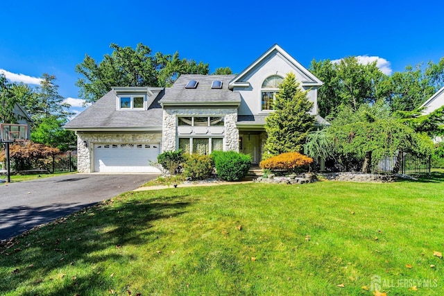 view of front of property with aphalt driveway, stone siding, fence, and a front lawn