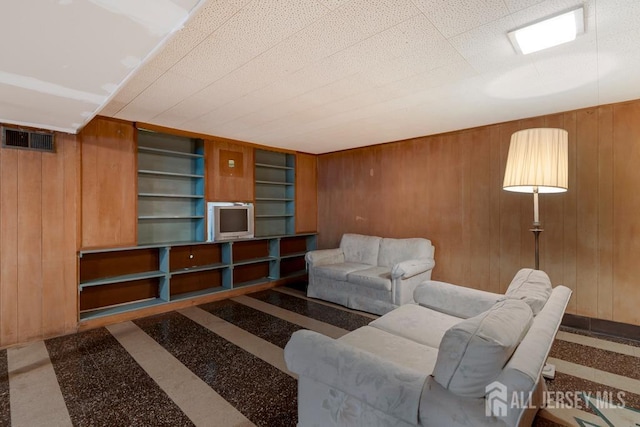 25 Orchard Rd, Middlesex, NJ 08846 - living room featuring wooden walls and inlaid floor details