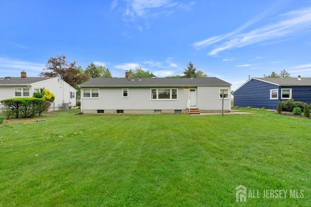 25 Orchard Rd, Middlesex, NJ 08846 - rear view of property with entry steps, a yard, and a chimney