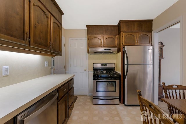 25 Orchard Rd, Middlesex, NJ 08846 - kitchen featuring appliances with stainless steel finishes, under cabinet range hood, light countertops, and light flooring