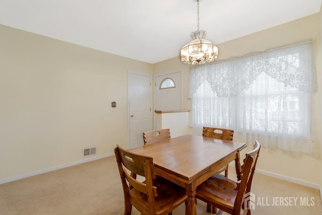 25 Orchard Rd, Middlesex, NJ 08846 - dining area with a chandelier, baseboards, and light colored carpet