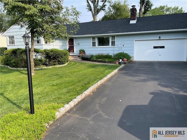 286 Franklin Rd, North Brunswick, NJ 08902 - ranch-style house featuring asphalt driveway, a chimney, a garage, a front lawn, and roof with shingles