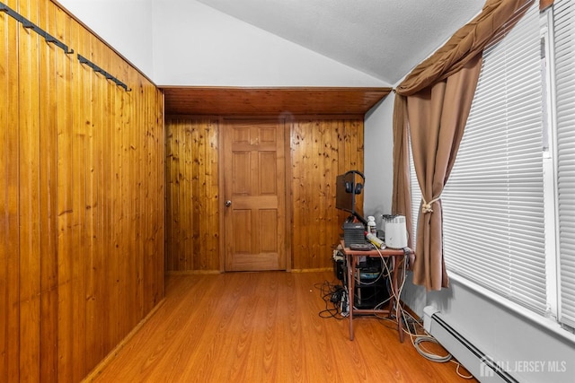809 Summerfield Ave, South Amboy, NJ 08879 - home office featuring vaulted ceiling, baseboard heating, and light wood-type flooring