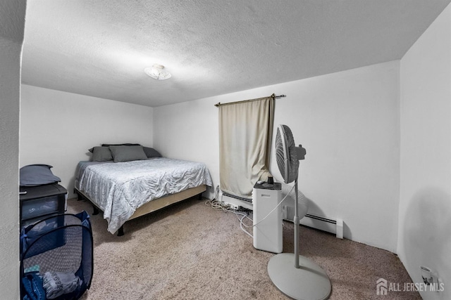 809 Summerfield Ave, South Amboy, NJ 08879 - carpeted bedroom featuring a baseboard heating unit and a textured ceiling
