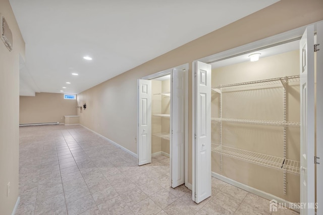 27 Rue Chagall, Franklin, NJ 08873 - finished below grade area with recessed lighting, a baseboard radiator, and light tile patterned floors