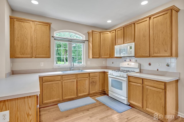 27 Rue Chagall, Franklin, NJ 08873 - kitchen featuring white appliances, light wood-style floors, recessed lighting, and light countertops