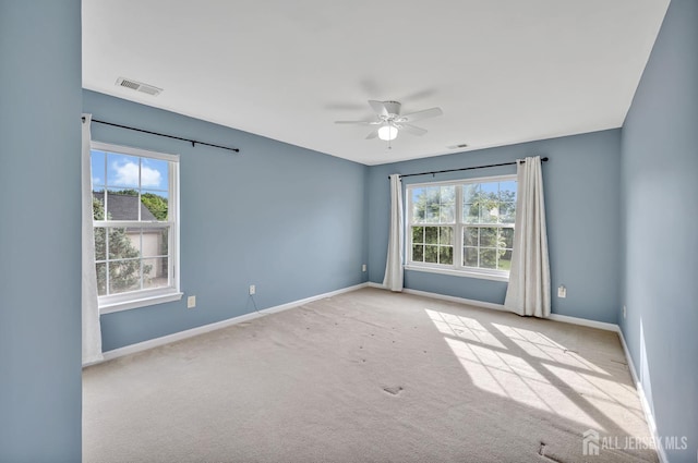 27 Rue Chagall, Franklin, NJ 08873 - unfurnished room featuring plenty of natural light, ceiling fan, and carpet flooring