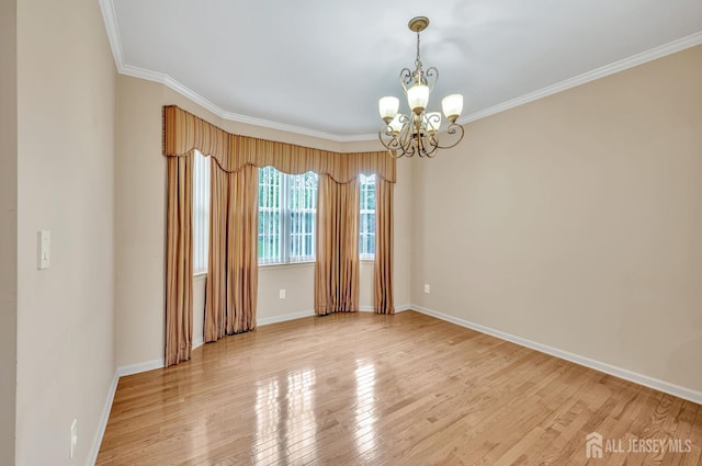 27 Rue Chagall, Franklin, NJ 08873 - unfurnished room with a chandelier, light wood-style floors, and crown molding