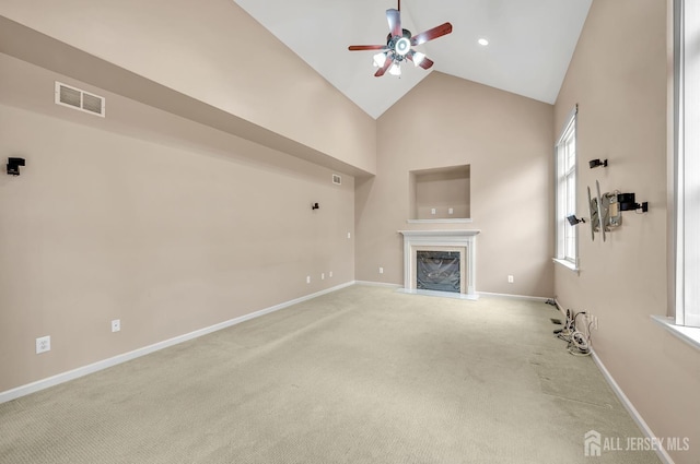27 Rue Chagall, Franklin, NJ 08873 - unfurnished living room featuring ceiling fan, high vaulted ceiling, light colored carpet, and a fireplace