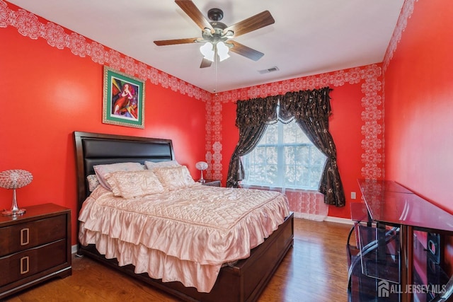 bedroom featuring dark wood-type flooring and ceiling fan