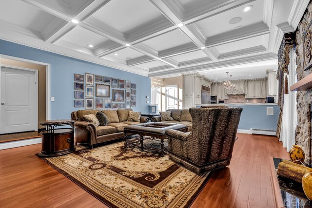 living room with beam ceiling, crown molding, wood-type flooring, and coffered ceiling