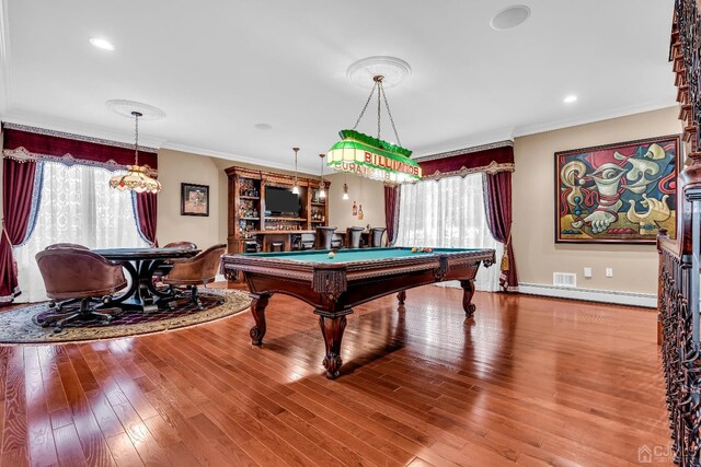 game room featuring wood-type flooring, a baseboard heating unit, crown molding, and pool table