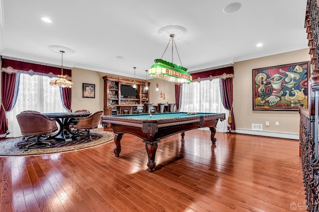 playroom with pool table, baseboard heating, wood-type flooring, and crown molding